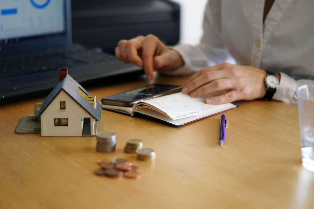 Person calculating finances for property management in Phuket