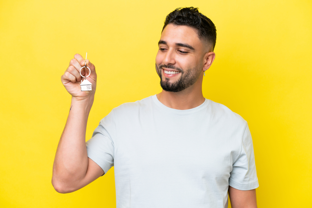 Happy tenant holding house keys after renting property in Phuket